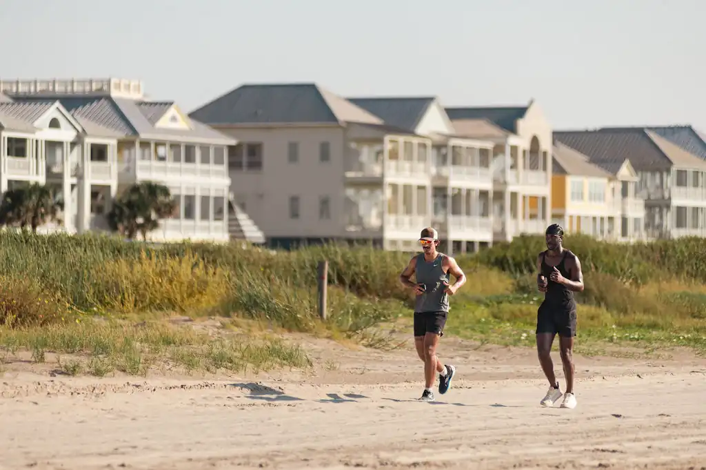 People running and enjoying the beach along the Texas Gulf Coast, an area GCPD works to protect