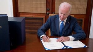 Former President Joe Biden signing Amendment