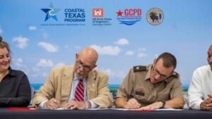 picture of officials signing an important document related to Gulf Coast Protection District