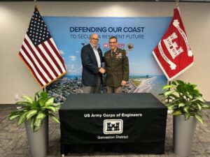 photo of Michel Bechtel shaking hands with US Army Corps of Engineers Ambassador