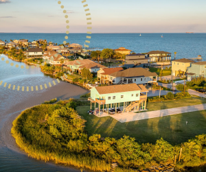 Aerial view of a Texas coastal community featuring elevated homes to protect from hurricanes.