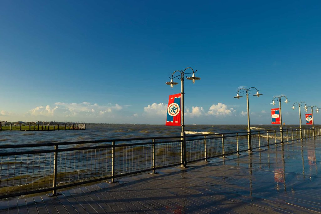 high tide and remnants from tropical storm Alberta causing bay waters to soak the boardwalk